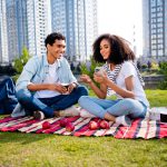 Full,Body,Photo,Of,Two,Beautiful,People,Sit,Blanket,Drink