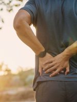 Back,Pain,,Close,Up,Young,Man,Has,Muscle,Injury,During