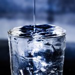 Pouring,Water,Into,Glass,With,Overflow,,Drinking,Water,Spills,Over