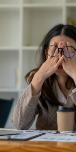 Tired,Business,Woman,Sleepy,And,Bored,From,Sitting,At,A